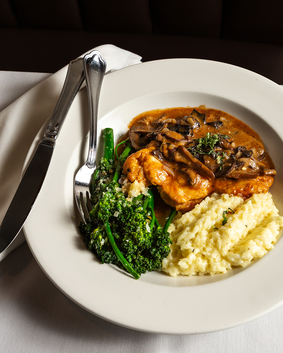 Amalfi chicken Marsala with mushrooms, risotto and broccolini